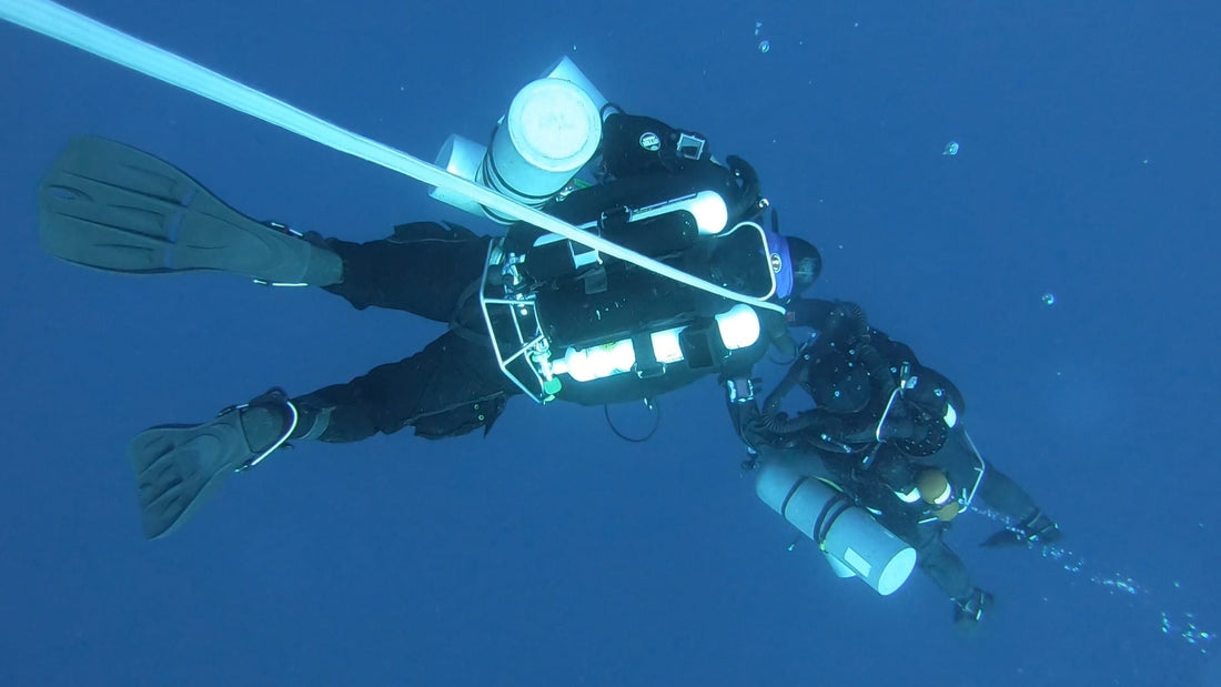  Rebreather Divers going down the line